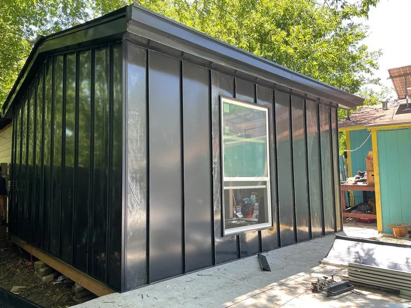 Black standing seam metal wall panels for Roof Inspection in Charles City